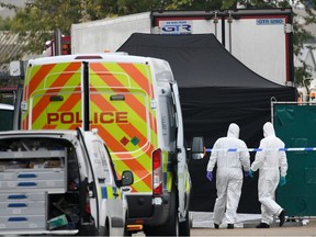 A Police forensic investigation team are parked near the site where 39 bodies were discovered in the back of a lorry on October 23, 2019 in Thurrock, England.