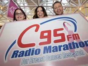 Breast cancer survivor  and event ambassador Amanda LePage, left, with C95 radio personality Shauna Foster and Rob Suski  pose for a photo in the final countdown for the C95FM Radio Marathon for Breast Cancer Research at the Circle Mall,  Friday, October 23, 2015.
