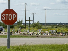 Hockey sticks, messages and other items were placed at a memorial for the Humboldt Broncos bus crash victims at the intersection of Highways 35 and 335.