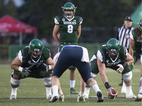 Saskatchewan Huskies' offensive guard Tanner Secord (left) looks forward to the team's first home playoff game since 2014.
