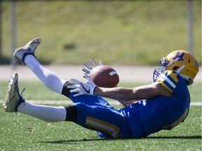 Saskatoon Hilltops receiver Connor Graham catches a touchdown from the ground during PFC action against the Calgary Colts at Saskatoon Minor Football Field on Sunday, September 22, 2019.