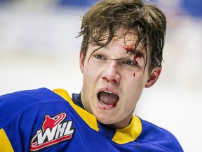 Saskatoon Blades forward Riley McKay reacts after a scrap with Lethbridge Hurricanes forward Nick Dorrington during first period WHL action in Saskatoon on Saturday, October 12, 2019.