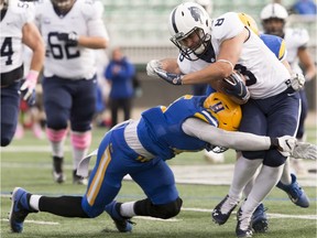 Saskatoon Hilltops linebacker Jadyn Pingue makes a tackle as the Saskatoon Hilltops play against the Edmonton Wildcats in their regular-season finale at SMF field in on Sunday, October 13th, 2019 in Saskatoon, SK.