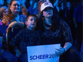 Conservative supporters watch as federal election results roll in at the Conservative Party of Canada headquarters at the International Trade Centre at Evraz Place.