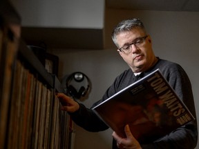 Saskatoon StarPhoenix sports editor Kevin Mitchell looks through his collection of approximately 3,000 records