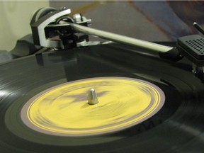 Kevin Mitchell's Dual 721 turntable plays one of his thousands of vinyl records.