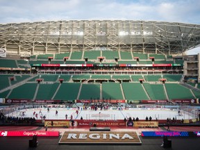 The Winnipeg Jets practise at Mosaic Stadium on Friday. The Jets and Calgary Flames are to meet Saturday, 8 p.m., in the NHL Heritage Classic.