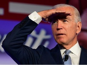 In this file photo taken on October 04, 2019 Democratic Presidential hopeful Joe Biden looks on during the SEIU Unions for All Summit in Los Angeles, California.