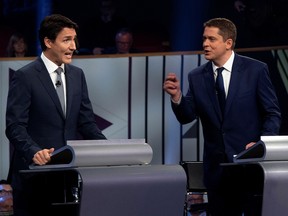 Liberal leader Justin Trudeau (left) and Conservative leader Andrew Scheer take part in the federal leaders French language debate in Gatineau, October 10, 2019. (Adrian Wyld/Pool via REUTERS/File Photo)