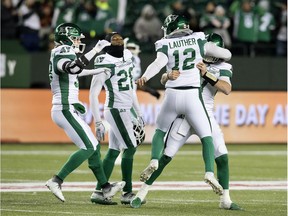 The Saskatchewan Roughriders celebrate a game-winning field goal by Brett Lauther, 12, on Saturday at Commonwealth Stadium. If the Roughriders post another victory over the Eskimos, who are to visit Mosaic Stadium on Saturday, the Green and White will finish first in the West Division for the first time since 2009.