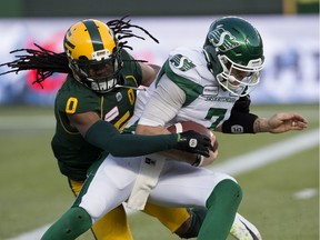 The Edmonton Eskimos' Don Unamba (0) battles the Saskatchewan Roughriders' quarterback Cody Fajardo (7) during first half CFL action at Commonwealth Stadium in Edmonton Saturday Oct. 26, 2019. Fajardo (7) fumbled the ball on the play. Photo by David Bloom ORG XMIT: POS1910261959476903