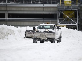 A plow clears snow at Minneapolis-St. Paul International Airport after a blizzard struck overnight on Nov. 27, 2019 in Bloomington, Minnesota. (Stephen Maturen/Getty Images)