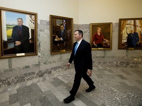 Alberta Premier Jason Kenney walks past portraits of former conservative premiers, prior to delivering the provincial budget, in Edmonton Thursday Oct. 24, 2019. Photo by David Bloom