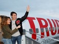 Liberal leader and Canadian Prime Minister Justin Trudeau waves with his wife Sophie Gregoire Trudeau as they board the plane at the airport in Vancouver, British Columbia, Canada October 12, 2019.