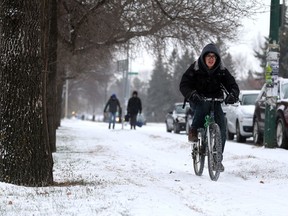 Saskatoon city council will debate changes to the city's cycling bylaw, including allowing those under 14 to cycle on sidewalks, at Monday's city council meeting. In this photo, a cyclist bikes to school during a snowy morning in Saskatoon on Nov. 1, 2017.
