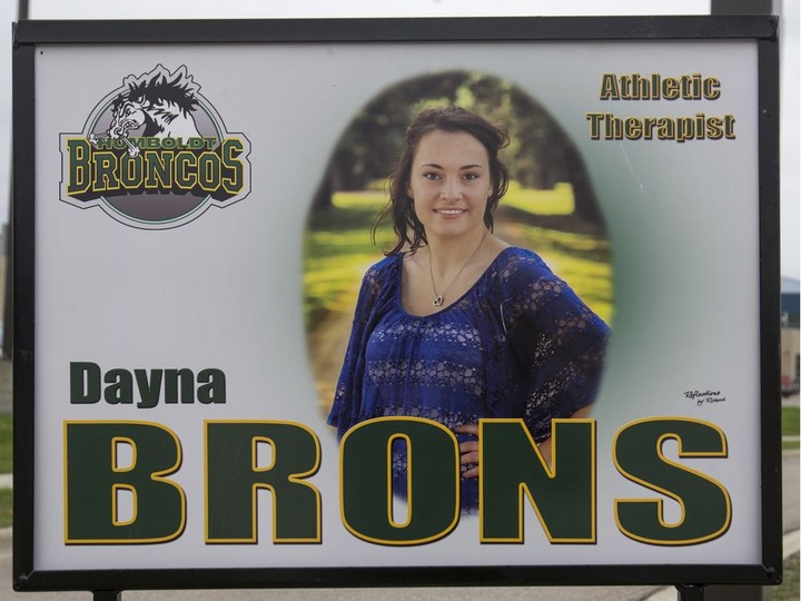  Green and yellow ribbons and a photograph of athletic therapist Dayna Brons along the boulevard on the road to Elgar Petersen Arena before the Humboldt Broncos home opener game on Sept. 12, 2018.