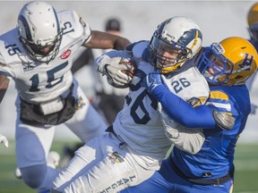 Langley Rams AJ Blackwell gets tackled with possession of the ball during the Canadian Bowl championship at SMF Field in Saskatoon,Sk on Saturday, November 17, 2018.