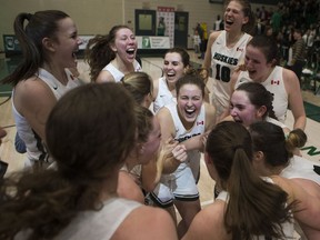 The U of S Huskies, shown here celebrating after winning the 2019 Canada West women's basketball conference championship, are back as a top U Sports contender this season.