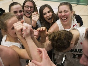 SASKATOON,SK--March 01 0301-Sports-Huskies Womens Basketball- The Huskies women's basketball team celebrates after winning the Canada West womenÕs basketball final at the PAC gym in Saskatoon, Sk on Friday, March 1, 2019.