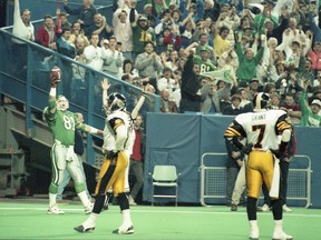 Ray Elgaard, left, celebrates the Saskatchewan Roughriders' first touchdown in the 1989 Grey Cup against the Hamilton Tiger-Cats.