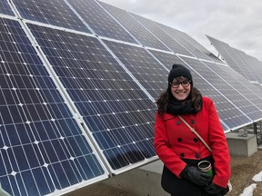 Saskatoon Coun. Sarina Gersher poses with the solar panels near the city's landfill in this photo from April 2017. (Photo courtesy Sarina Gersher)