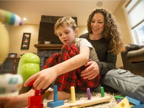 Trystan and Amy Shout play with toys in their home. Photo taken in Saskatoon, SK on Friday, November 8, 2019.