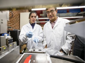 Dr. Daniel Chen, a professor at the U of S college of engineering who is working on projects involving 3D printing human tissue for medical purposes, and Zahra Yazdanpanah, PhD student in the college of engineering, discuss a sample on a 3D printer.
