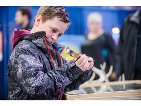 Mark Cholowsky, eleven, along with his grandmother admire a knife as craftsmen, artists, hobbiests, and other vendors display and sell their home-made products for thousands of shoppers during the 2019 Sundog Faire at Sasktel Centre on Saturday, November 30th, 2019 in Saskatoon, SK,
