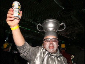 Dressed as the Grey Cup, Darryl Henderson gives a cheers in the Spirit of Edmonton Team Party as thousands of fans join the Grey Cup celebrations at the BMO Centre on Friday, November 22, 2019.