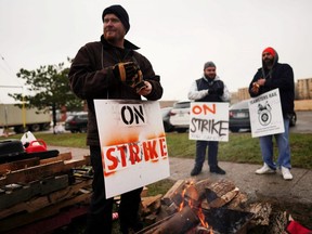 Teamsters Canada union workers picket at the Canadian National Railway at the CN Rail Brampton Intermodal Terminal after both parties failed to resolve contract issues, in Brampton, Ont., on Nov. 19, 2019.