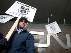 Teamsters Canada union workers picket outside the headquarters of Canadian National Railway (CN Rail) after both parties failed to resolve contract issues, in Montreal, Quebec, Canada November 19, 2019.
