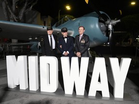T.K. Ford, Hank Kudzik and Jack Holder pose at the premiere of "Midway" at the Regency Village Theatre in Westwood, Calif., on Tuesday, Nov. 5, 2019.
