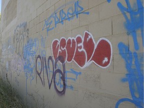 A wall in Regina displays gang-related graffiti.