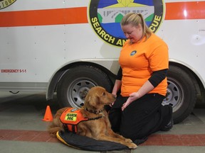Kate Dean, a member of Saskatoon Search and Rescue and a civilian dog trainer, with her three-year-old Golden Retriever, Jenga at the city's York Avenue fire station in Saskatoon on Nov. 28, 2018. Jenga, who was trained to be a search and rescue dog in Edmonton, is the first pup trained as a civilian search and rescue dog here in Saskatchewan. Dean and Jenga will now work with the Saskatoon Police Service on missing person cases and officials say demand for these types of dogs is growing.