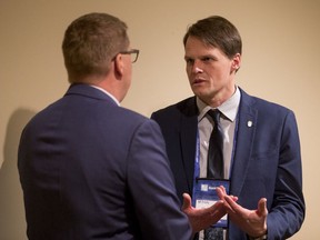 Saskatoon Mayor Charlie Clark (right) speaks with Saskatchewan Premier Scott Moe at the SUMA convention to announce a new revenue sharing formula in Saskatoon, SK on Monday, February 4, 2019.