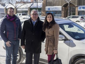Michael van Hemmen, an Uber business manager, left, Joe Hargrave, Minister responsible for Saskatchewan Government Insurance (SGI), and Michelle Okere, regional manager of Saskatchewan and Manitoba, MADD Canada, stand for a photograph following the first Uber ride outside of city hall during a media event in Saskatoon, SK on Tuesday, February 5, 2019.