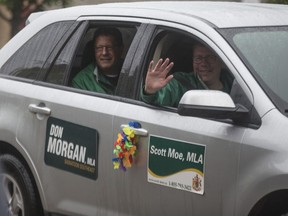 Saskatchewan Premier Scott Moe waves to onlookers in downtown Saskatoon during the annual Pride Parade on June 22, 2019.