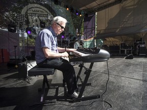 Musician Kim Salkeld, who's performing at The Bassment's Jazz Singer YuleFest on Dec. 7, is seen here setting up his piano at the 2019 Jazz Festival in Saskatoon.
