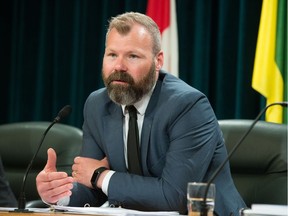 Minister responsible for SaskPower Dustin Duncan speaks to media at a press conference following the reslease of the Crown's annual report at the Saskatchewan Legislative Building.