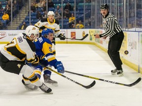 Saskatoon Blades defencemen Aidan De La Gorgendiere reaches for the puck in a game against the Brandon Wheat Kings at the Sasktel Centre on Saturday, November 9, 2019.