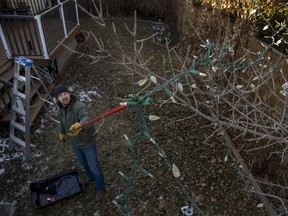 yler Billay hangs Christmas lights in his backyard in Saskatoon on Nov. 23, 2019.