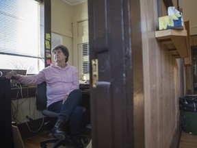 Lynne Tolley, administrator of the Village of Kinley, works in her office in the Kinley Hall in Kinley, Sask. on Dec. 3, 2019. Tolley mostly works from her home in Saskatoon due to a lack of internet in the village.