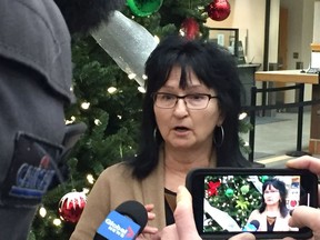 Saskatoon business and property owner Veronica Kilpatrick talks to reporters at city hall about the city's proposed regulations for short-term rental properties like those offered on online platforms like Airbnb. (Phil Tank/The StarPhoenix)