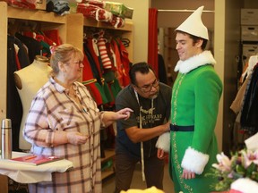 (left to right) Costume designers Bonnie Deakin and Jeff Chief work on actor Felix LeBlanc's costume for Persephone Theatre's production of Elf: The Musical in Saskatoon, opening on Dec. 6, 2019.