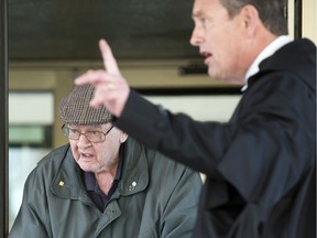 Father Robert MacKenzie, appearing for an appeal of an extradition order back to Scotland, where he faces sexual assault allegations leaves with his defence lawyer Alan McIntyre in Regina on Wednesday, December 4, 2019.