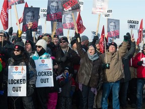 Striking Unifor members cheer during a Unifor union rally near the Co-op refinery on the north side of Regina, Saskatchewan on December 6, 2019.