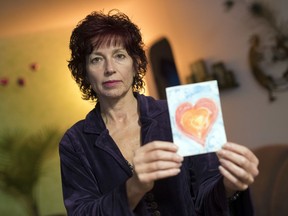 Linda Yablonski holds a card made by her late sister Carla Cullen in Regina. Yablonski's 51-year-old sister Carla Cullen died by suicide in July 2018.