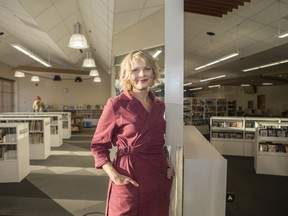 Lisa Erickson, the chair of the Saskatoon Public Library board, who helped lead the lobby for a new downtown library, poses at the Rusty Macdonald Branch Library in Saskatoon on Dec. 13, 2019.