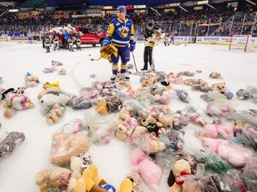 Saskatoon Blades forward Zach Huber surveys the ice, littered with stuffed animals, during the annual Teddy Bear Toss Game as the Blades went on to defeat the Prince Albert Raiders 4-1 Sunday, Dec. 15, 2019 at SaskTel Centre.