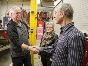 David Hume, left, shakes hands with John Wiebe as Marianne Wiebe looks on. On Sept. 3, 2019 Hume and fellow bystanders helped administer an automated external defibrillator (AED) and CPR to Wiebe as he suffered a cardiac arrest in the Umea Vast Park. Photo taken in Saskatoon on Monday, Dec. 16, 2019.